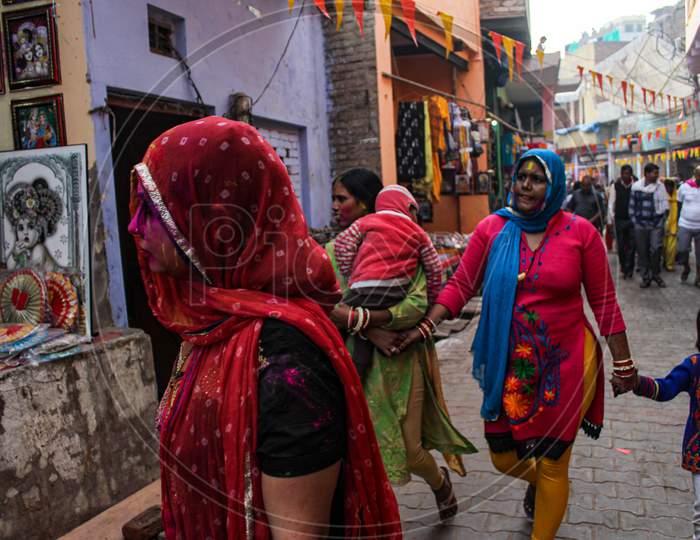 Mathura, Uttar Pradesh/ India- January 6 2020: Indian Women Celebrating Holi By Playing With Colors In The Streets Of Mathura.