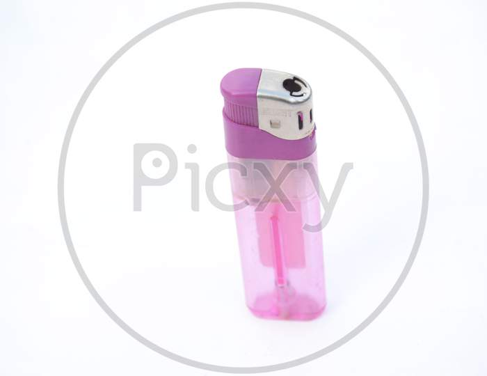 The Purple Color Gas Lighter Isolated On White Background.