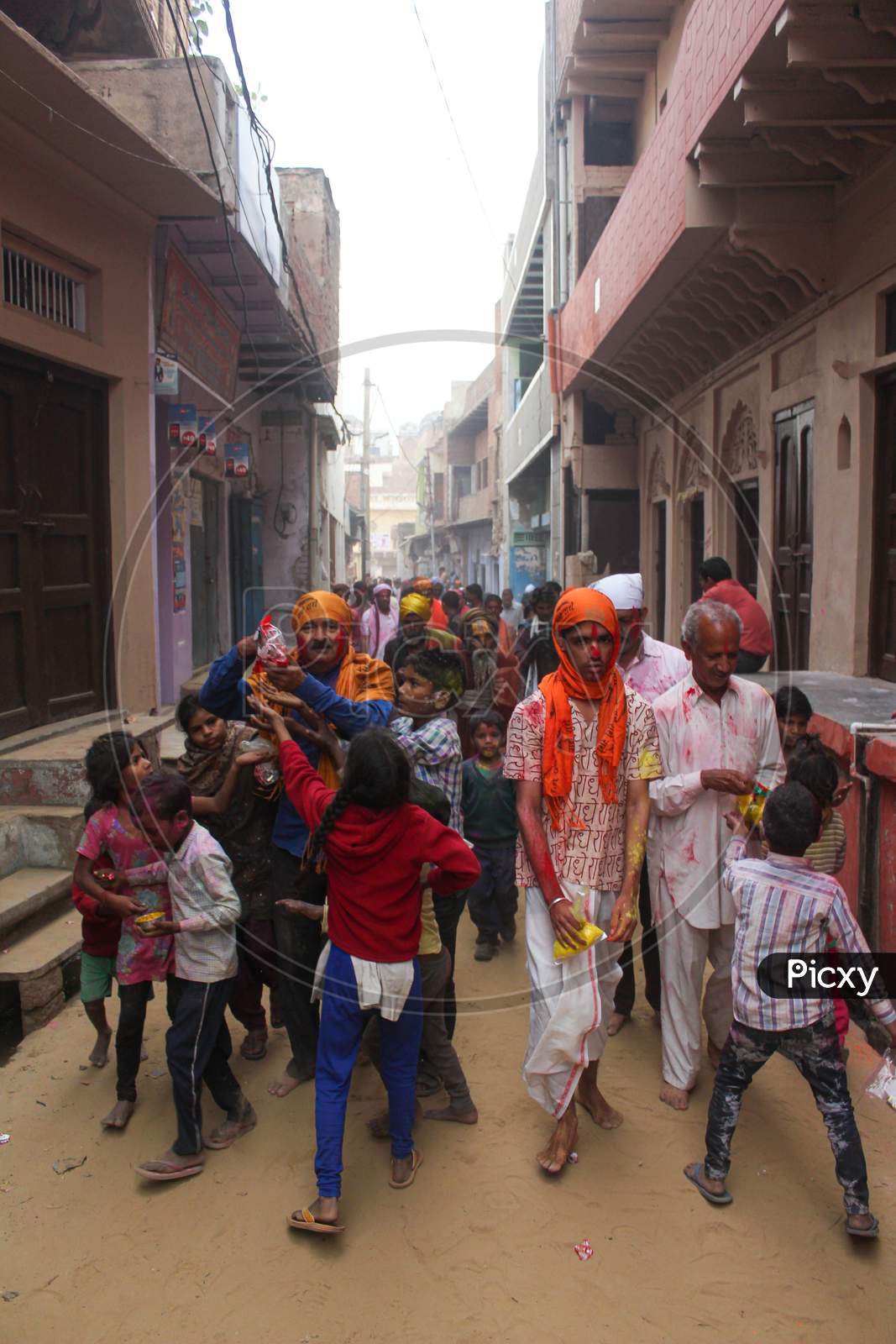 Mathura, Uttar Pradesh/ India- January 6 2020: Indian Man Distributing Prasad On Street In Mathura During The Holi Festival.