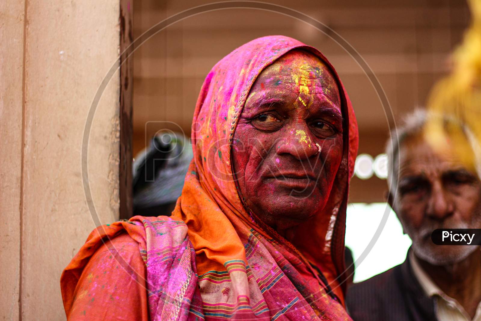 Mathura, Uttar Pradesh/ India- January 6 2020: An Unidentified Hindu Sadhu With Face Smeared With Color Looks As He Participates In The Holi Celebration At Temple.