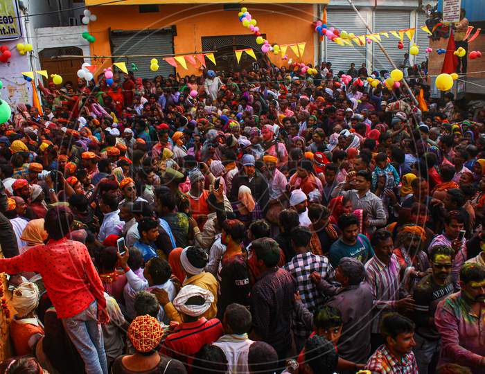Mathura, Uttar Pradesh/ India- January 6 2020: Large Crowd Of Hindu Devotees Playing With Colourful Powder And Celebrating Holi In Temple At Mathura During Holi.