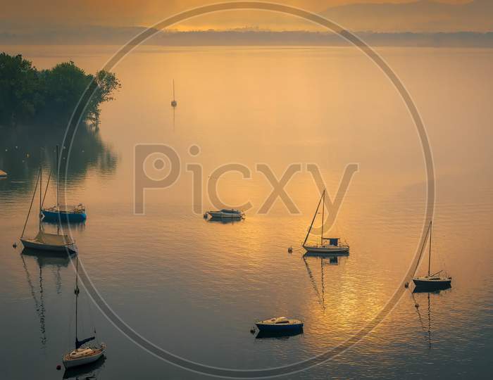 Yachts In The Early Morning Mist At Lesa Lake Maggiore