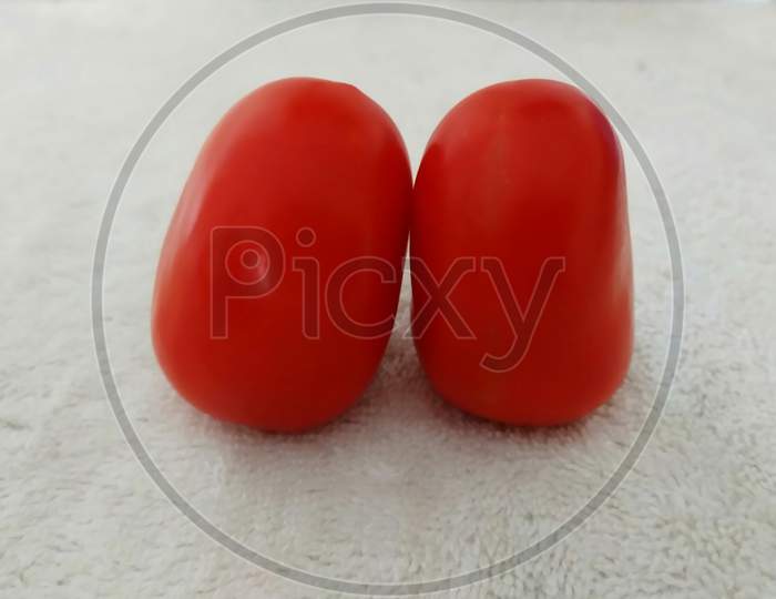 Two Fresh Tomatos Isolated on White Background