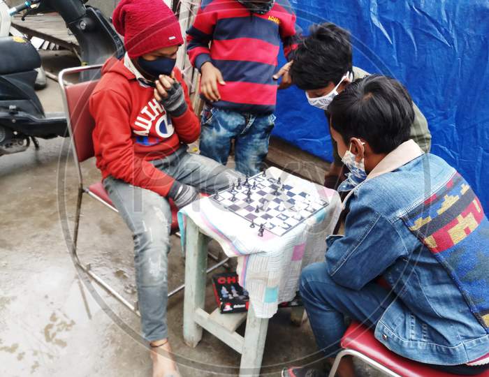 Gully Boys playing Chess