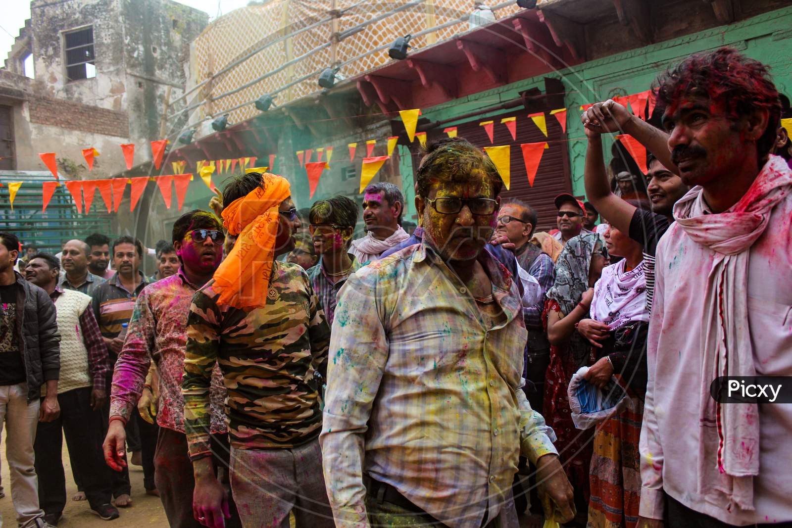 Mathura, Uttar Pradesh/ India- January 6 2020: A Crowd Playing Holi On The Street Of Mathura.