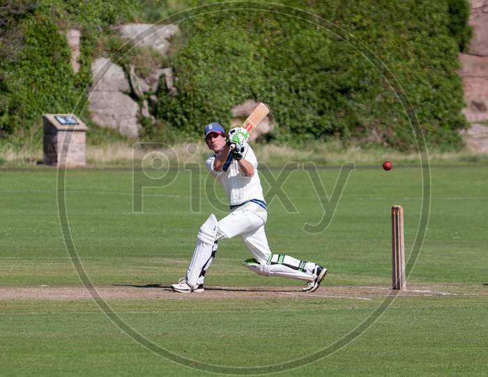 Playing Cricket On The Green At Bamburgh