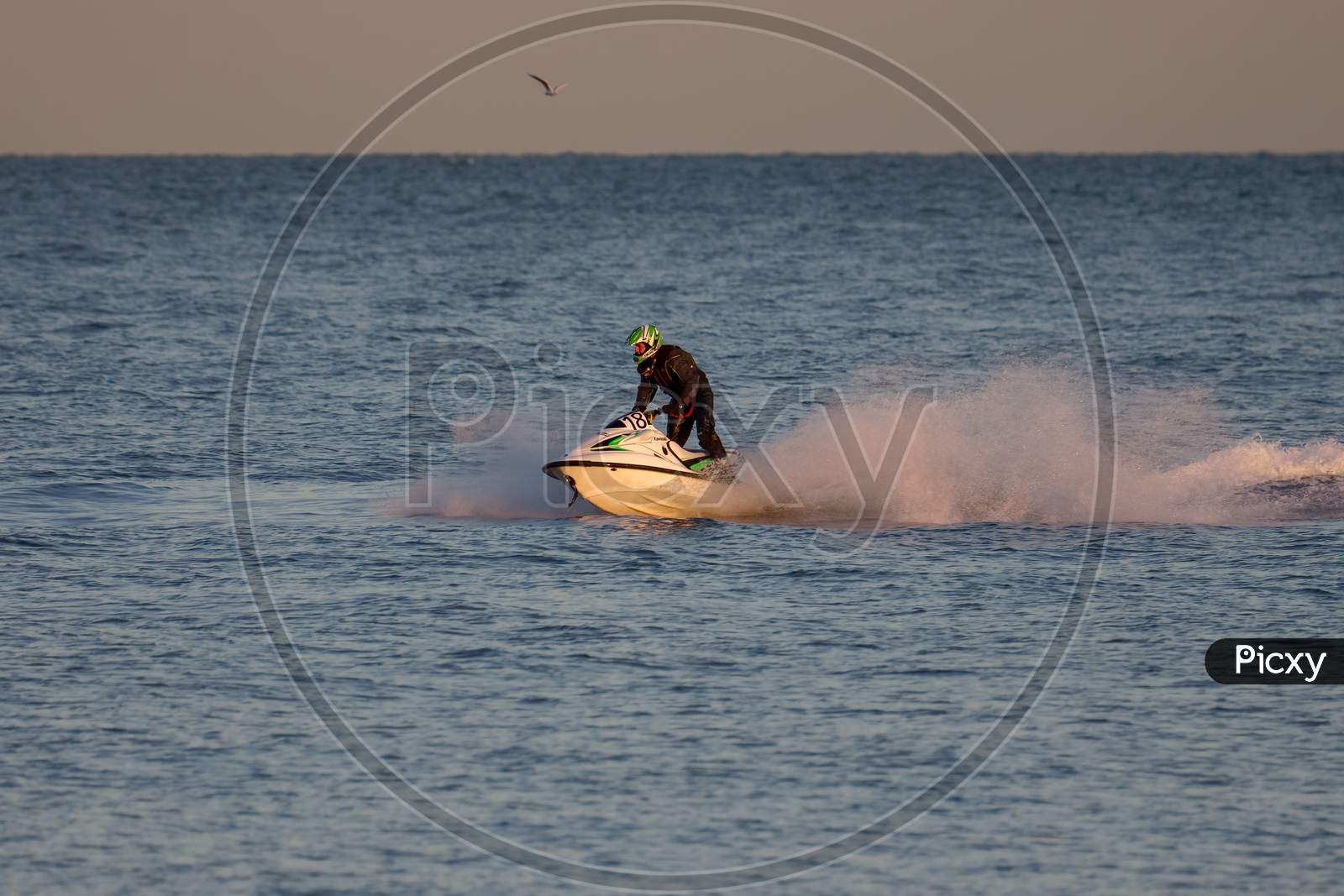 Dungeness, Kent/Uk - December 17 : Man Riding A Jet Ski Off Dungeness Beach In Kent On December 17, 2008. One Unidentified Person