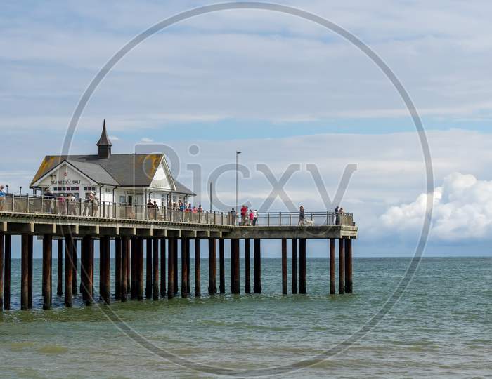 People Enjoying A Sunny Day Out On Southwold Pier