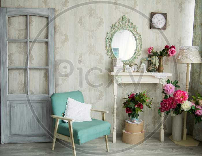 Vintage Country House Interior With Mirror And A Table With A Vase And Flovers