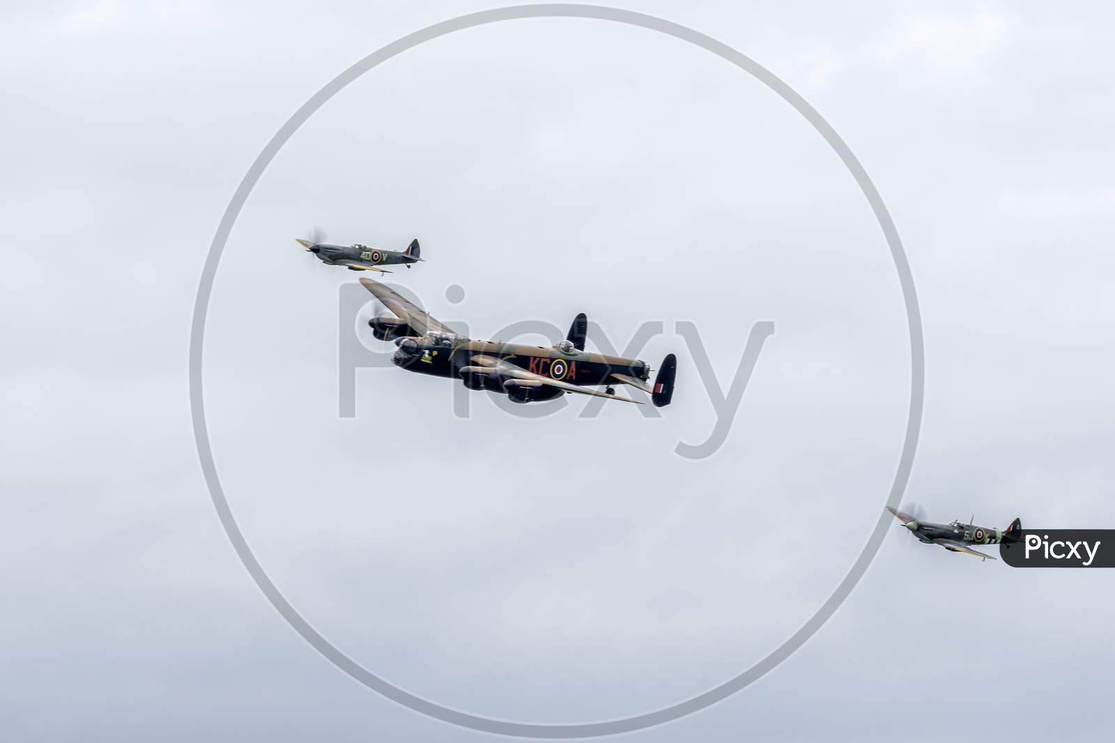 Avro Lancaster Flanked By Two Spitfires