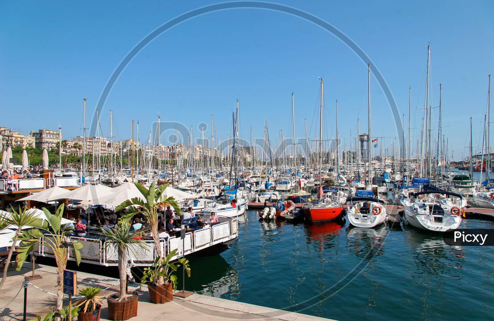 Assortment Of Boats And Yachts Moored At The Marina In Barcelona
