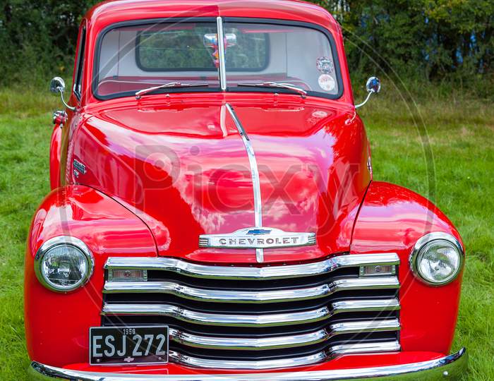 Rudgwick, Sussex/Uk - August 27 : Old Red Chevrolet At Rudgwick Steam Fair In Rudgwick Sussex On August 27, 2011