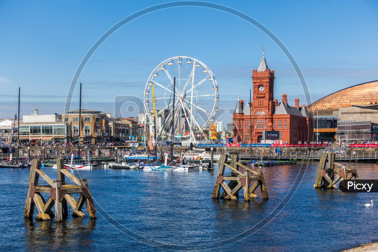 Cardiff/Uk - August 27 : Ferris Wheel And Pierhead Building In Cardiff On August 27, 2017. Unidentified People