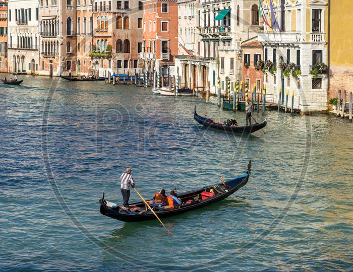 Gondoliers Plying Their Trade On The Grand Canal Venice