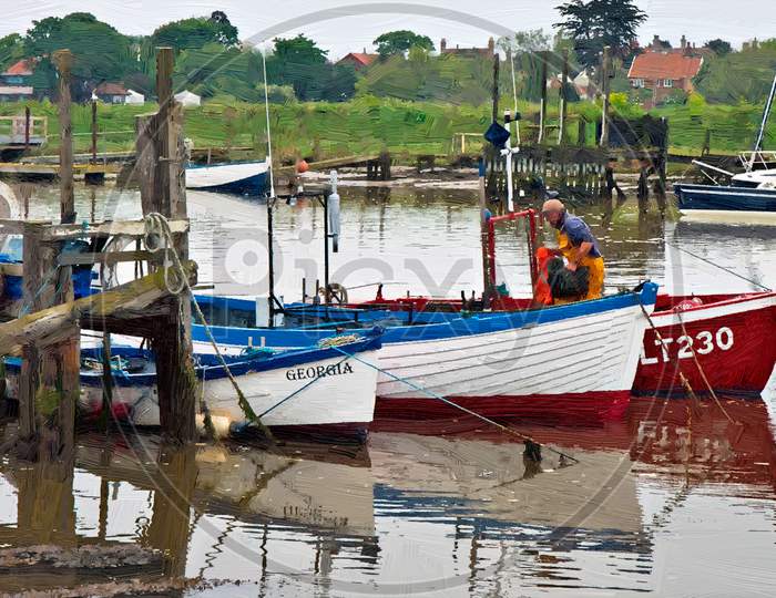 Row Of Fishing Boats In Southwold Harbour