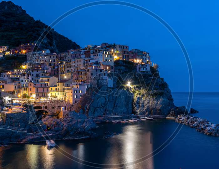 Manarola, Liguria/Italy  - April 20 : Night-Time View Of Manarola Liguria Italy On April 20, 2019. Unidentified People