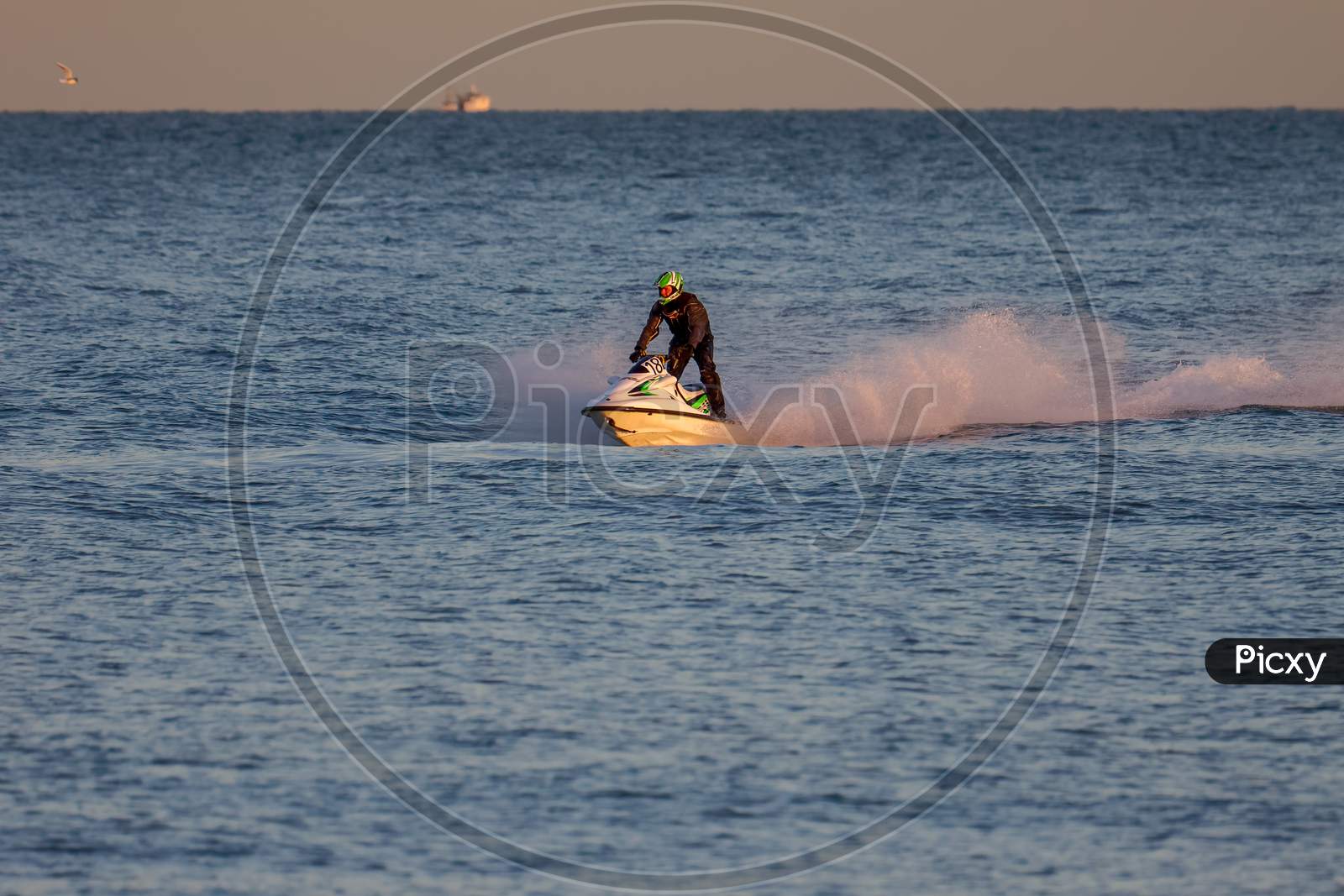 Dungeness, Kent/Uk - December 17 : Man Riding A Jet Ski Off Dungeness Beach In Kent On December 17, 2008. One Unidentified Person