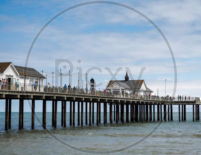 People Enjoying A Sunny Day Out On Southwold Pier