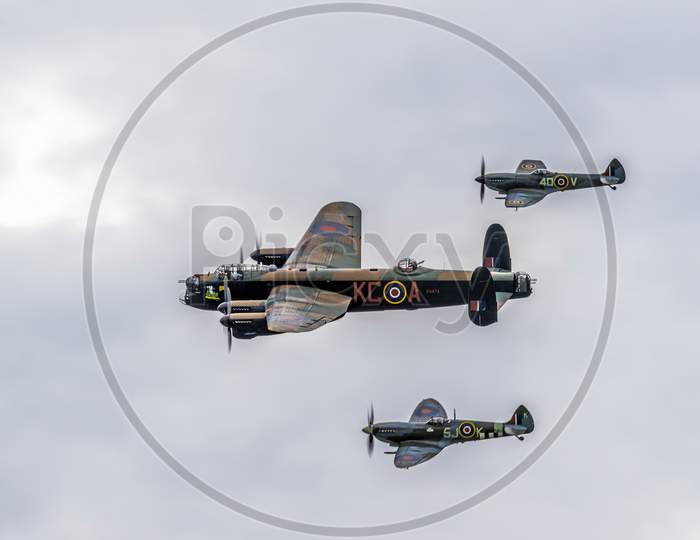 Avro Lancaster Flanked By Two Spitfires