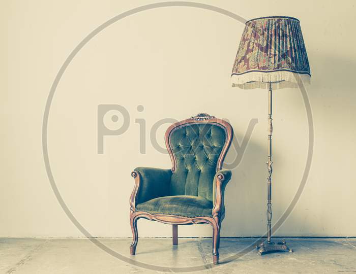 Vintage And Antique Chair With White Wall Background