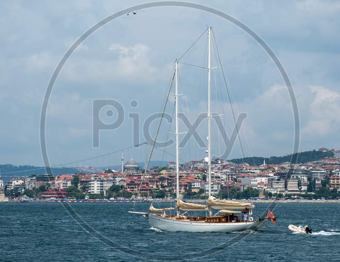 Istanbul, Turkey - May 24 : View Of A Yacht Sailing Up The Bosphorus In Istanbul Turkey On May 24, 2018