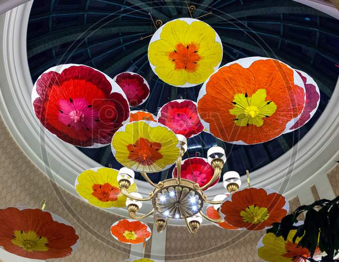 Brightly Coloured Parasols Hanging From The Ceiling