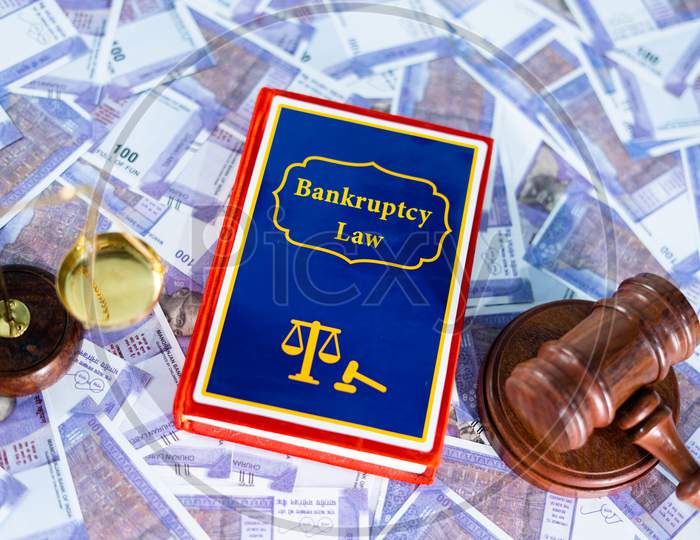 Concept Of Commencement Of Bankruptcy Law, Showing By Placing Bankruptcy Law Book On Banknotes With Judge Gavel And Balance Scale