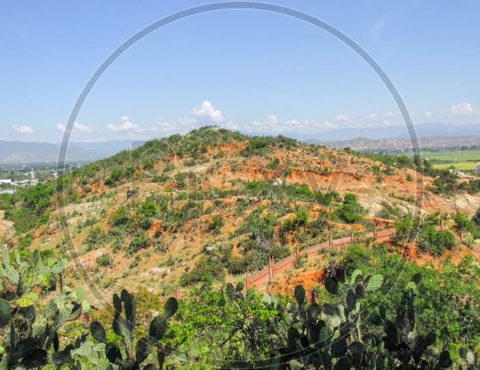 Aerial View Of The Mountain With Red Soil And Cactus