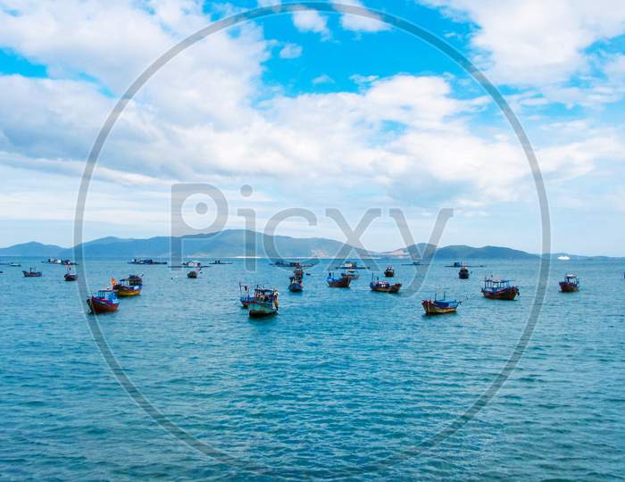 Traditional Vietnamese Fishing Boats Parked And Floating In The Water After A Long Day Of Work In Nha Trang Bay, Vietnam