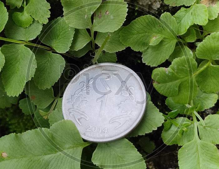 One rupees coin