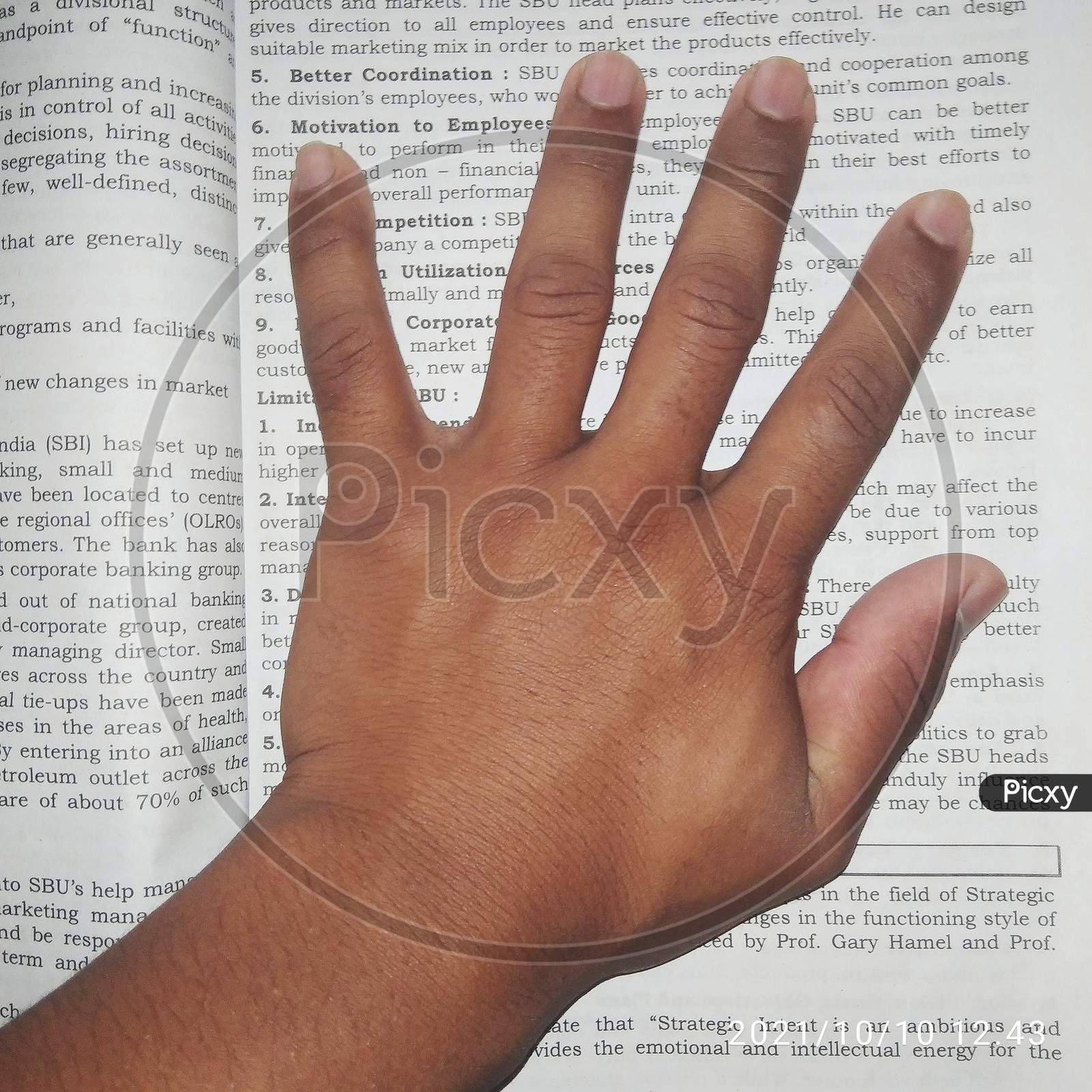 Image of Hand, hand on book, boys hand close up, fingers-IN972185-Picxy