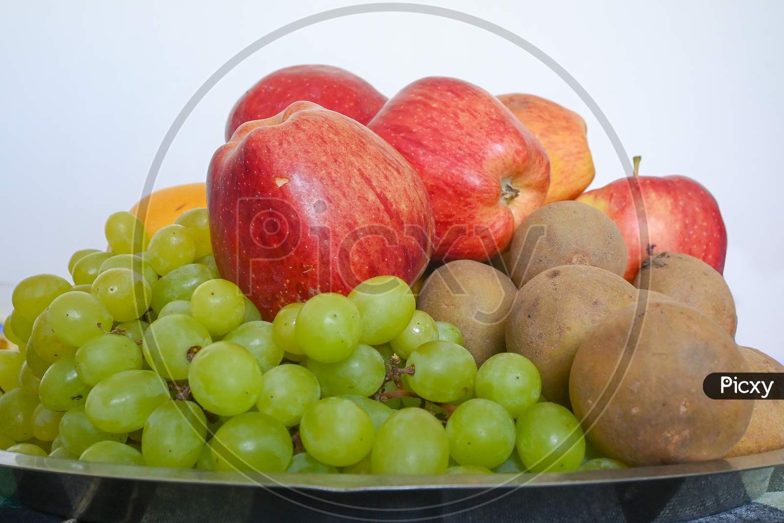 Closeup Of Different Fruits Isolated On White Background
