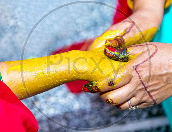 Indian Bridal Turmeric Haldi Paste On Her Hand