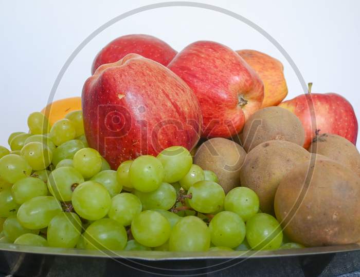 Closeup Of Different Fruits Isolated On White Background