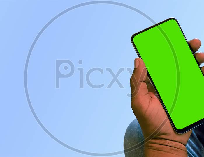 Closeup Of Green Screen Smartphone In Hand