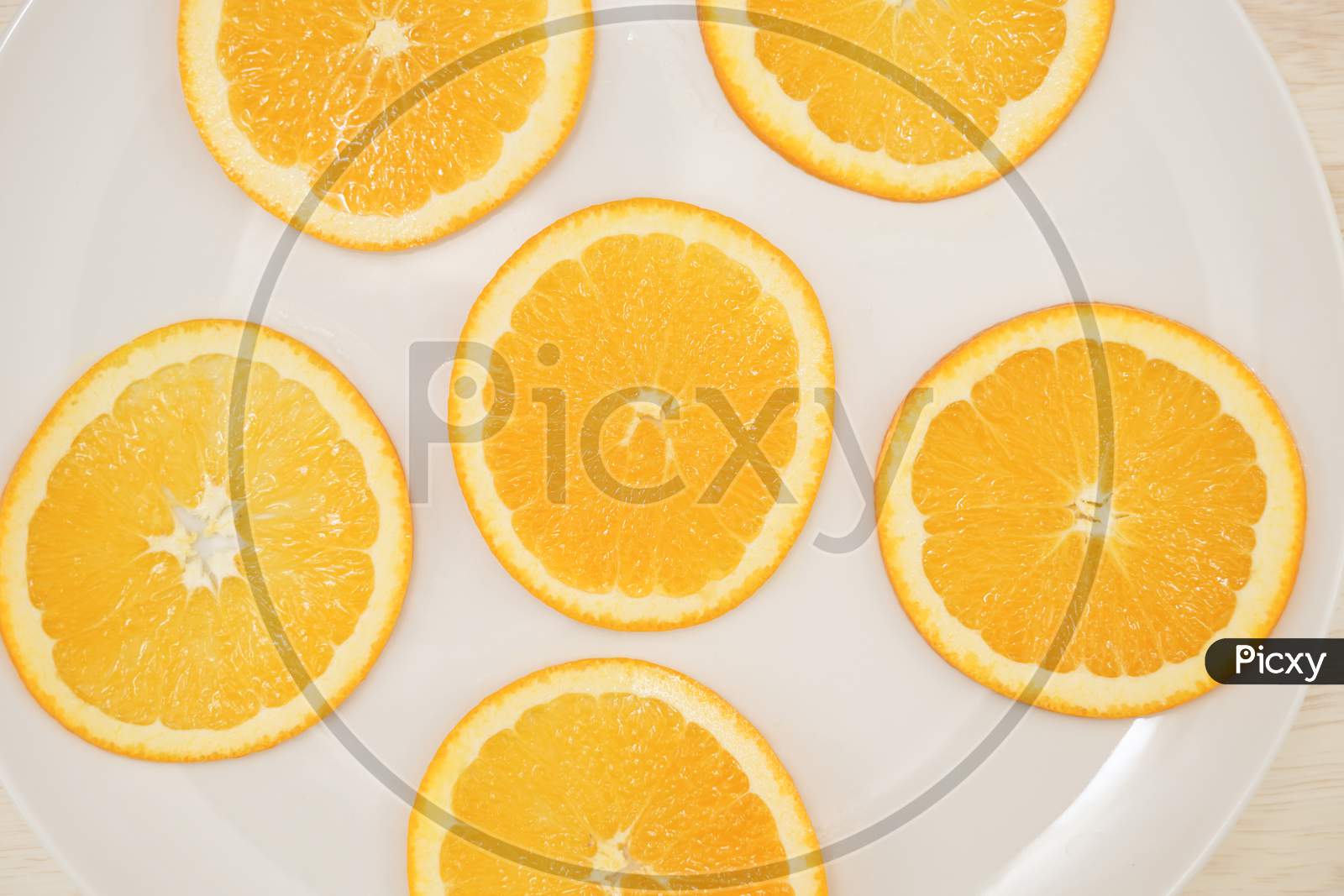 Image Of Orange Placed On A Plate