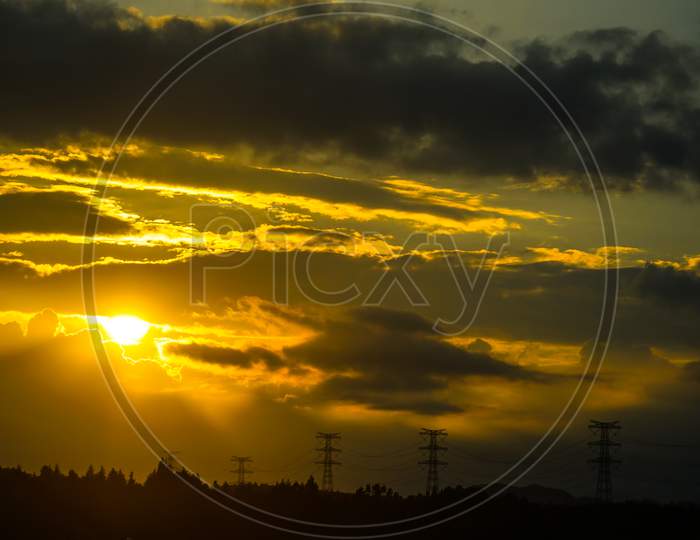 Silhouette Image Of A Sunset And A Steel Tower