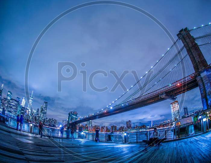 Night View And People Of Manhattan And Brooklyn Bridge