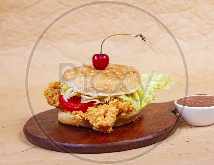 Juicy Fish Burger, Hamburger Or Cheeseburger With One Fish Patties, With Sauce. Concept Of American Fast Food. Copy Space