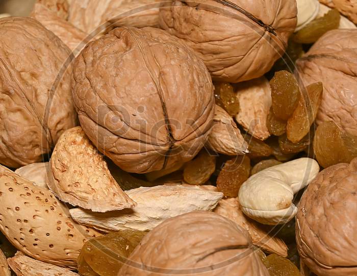 Closeup Shot Of Walnuts And Dried Fruits