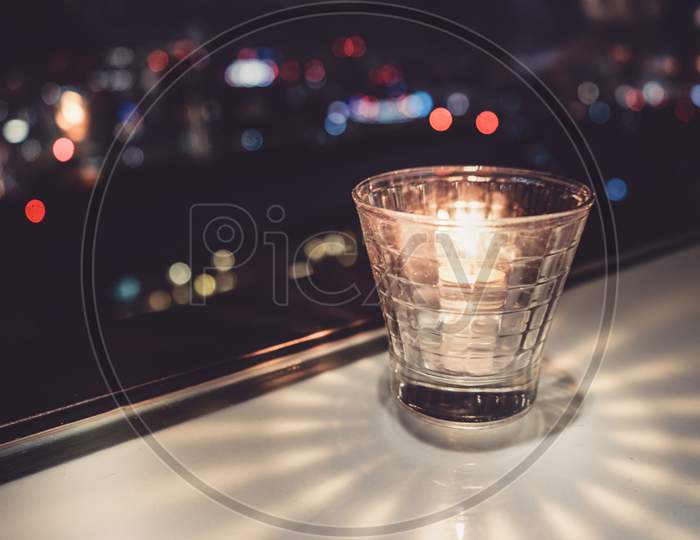 Stylish Candle And The City Of Night View