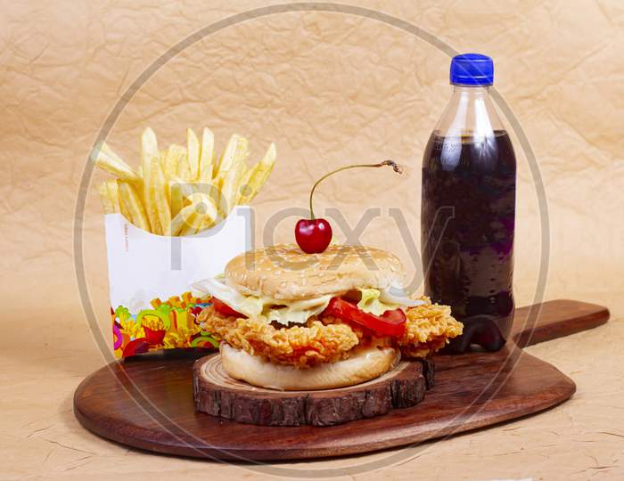 Juicy Fish Burger, Hamburger Or Cheeseburger With One Fish Patties, With Sauce French Fries And Cold Drink. Concept Of American Fast Food. Copy Space