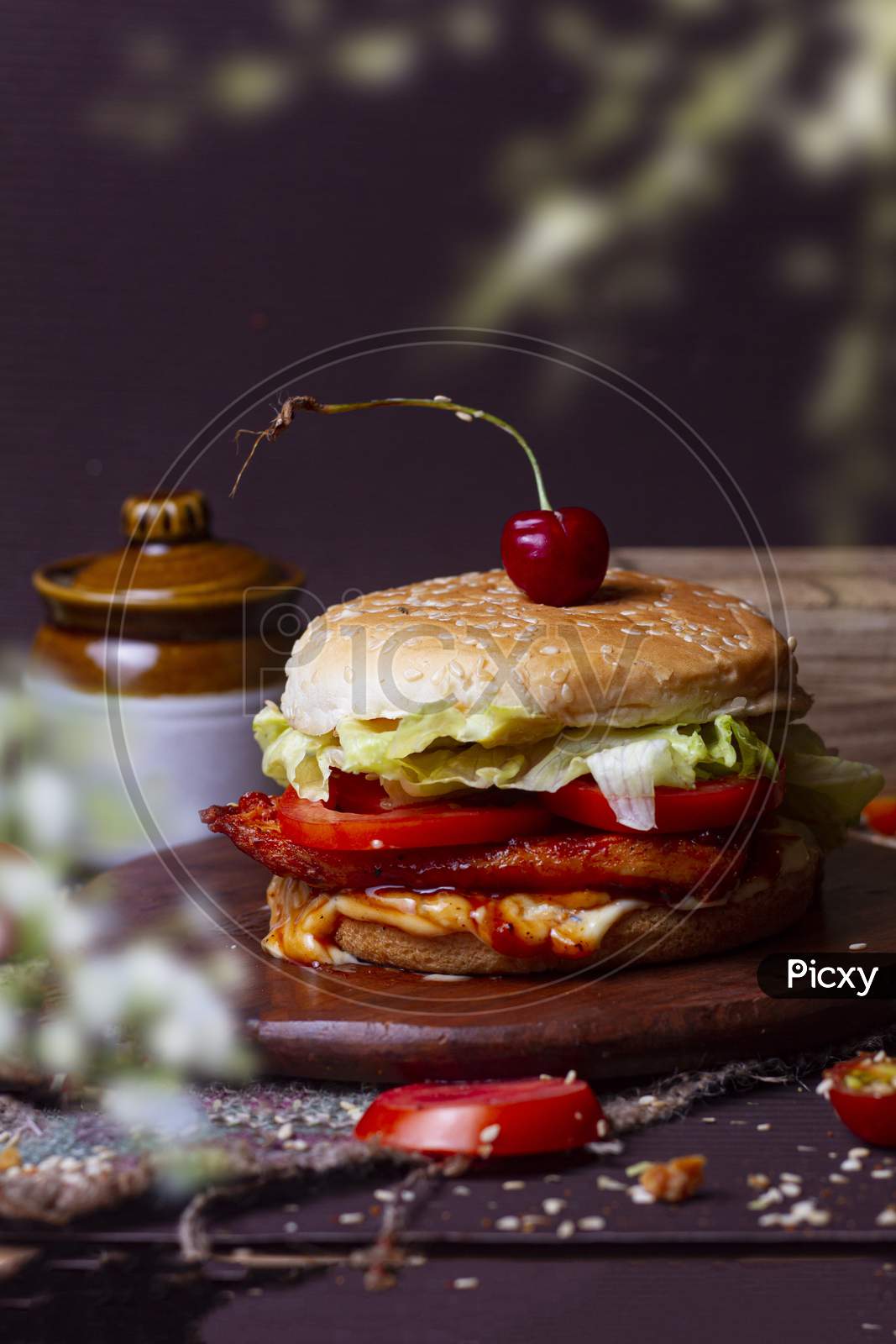Juicy Chicken Grill Burger, Hamburger Or Cheeseburger With One Chicken Patties, With Sauce. Concept Of American Fast Food. Copy Space