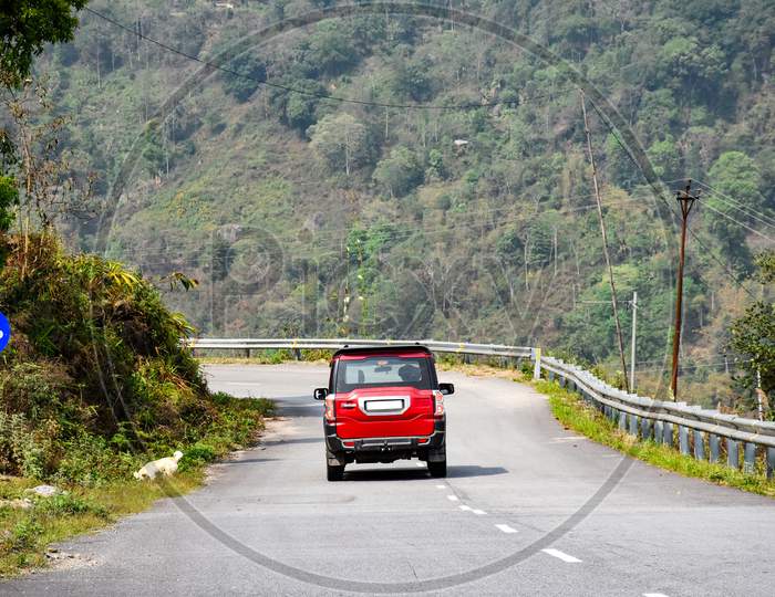 Red Sports Car Driving On The Open Himalaya Road