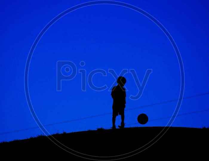 Boy Playing With A Soccer Ball (With Wires)