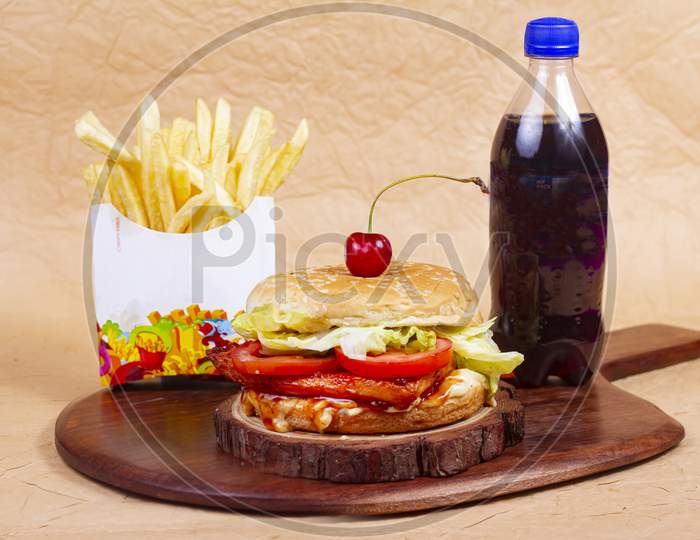 Juicy Chicken Grill Burger, Hamburger Or Cheeseburger With One Chicken Patties, With Sauce, French Fries And Cold Drink.. Concept Of American Fast Food. Copy Space