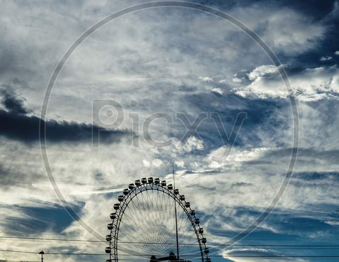 Ferris Wheel And Dusk Sky