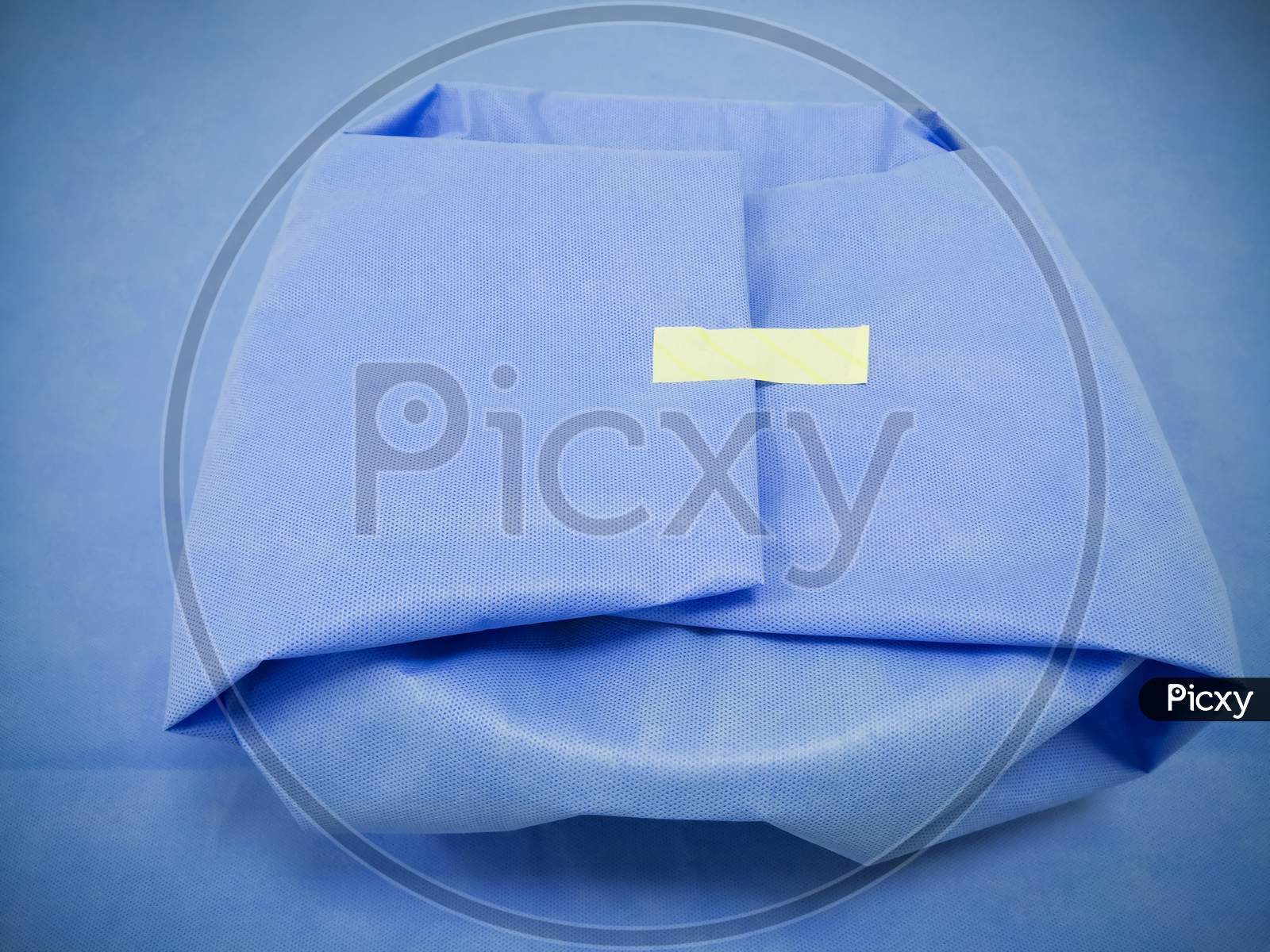 Medical Surgical Set Wrapped With Disposable Blue Drape Sheet. Selective Focus