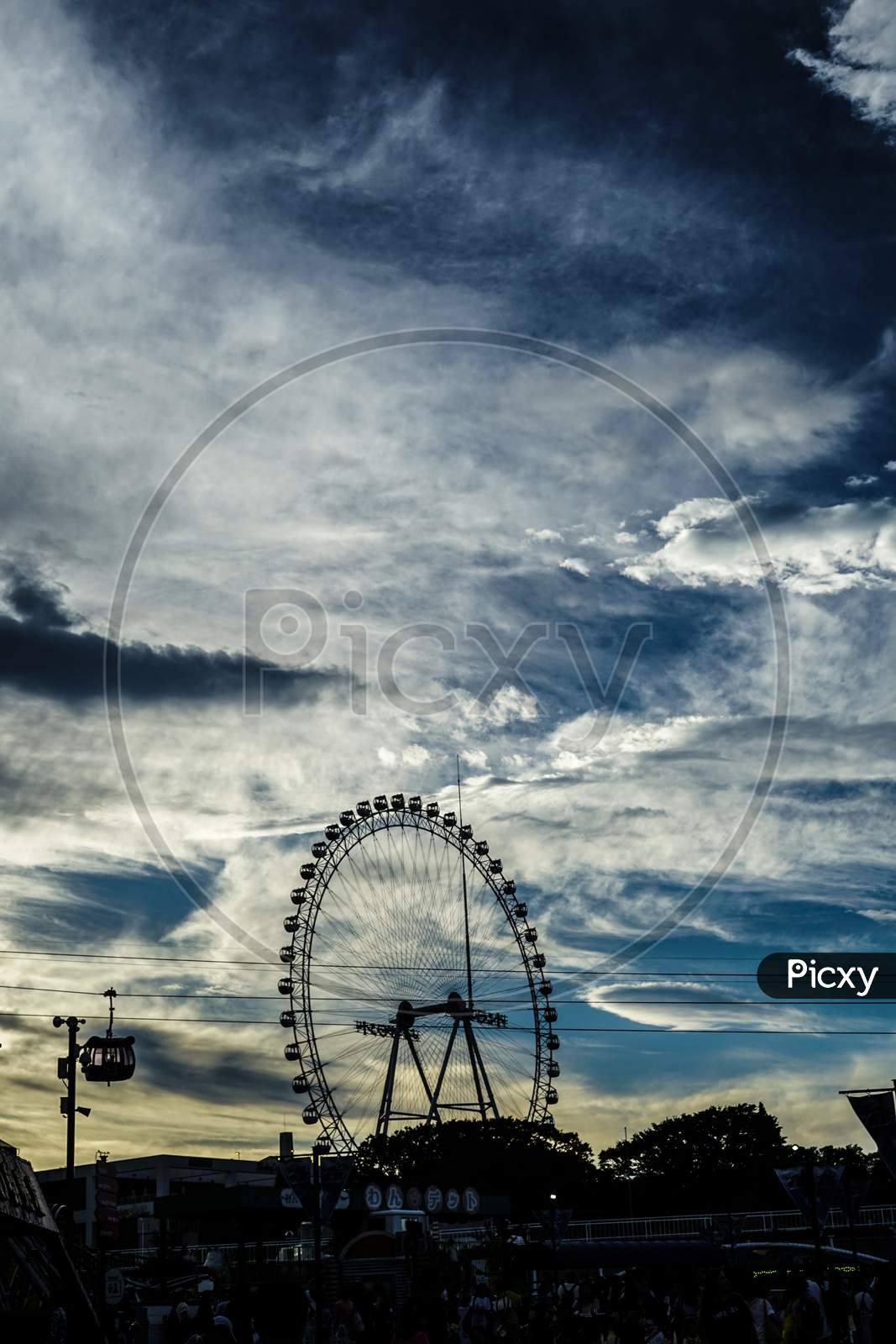 Ferris Wheel And Dusk Sky
