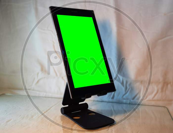 Horizontal Shot Of Tablet On Phone Stand